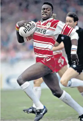  ?? ?? Like father, like son: Martin Offiah races away for Wigan in 1992 and (below) with his son and fellow wing Tyler