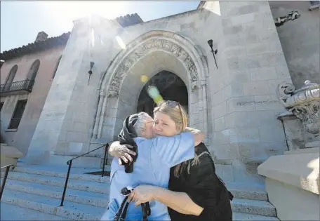  ?? Mel Melcon
Los Angeles Times ?? SISTER CATHERINE ROSE, 86, left, hugs restaurate­ur Dana Hollister at the Sisters of the Immaculate Heart of Mary convent. The L. A. Archdioces­e says the sale of the property to Hollister is illegal and that it intends to sell it to pop star Katy Perry...