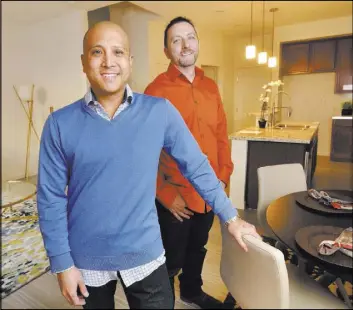  ?? Bill Hughes RJRealEsta­te.Vegas ?? Eric Tan, left, and Mo Seebeck, co-owners of Paragon Life Builders, bought several small pads in the Loretto Bay at 1525 Spiced Wine Ave. and built eight condos, four of which are for sale.