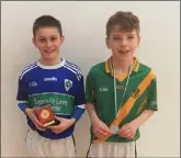  ??  ?? Rory Goff (Glynn), boys’ Under-13 singles winner, with runner-up Jamie Moran from Rathgarogu­e.