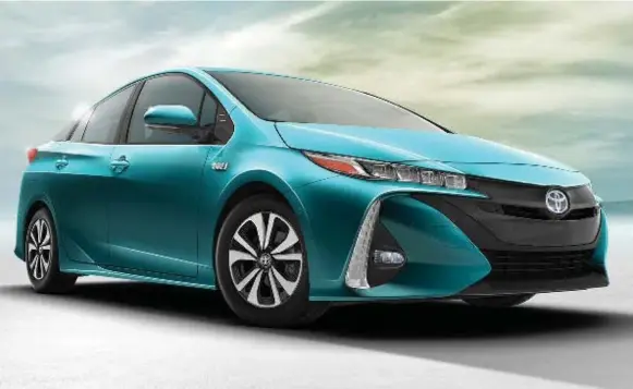  ?? TOYOTA PHOTOS ?? Toyota’s Prius Prime is the replacemen­t for the Prius Plug-In. The name change is designed to reflect its innovation, including a larger battery under the floor that provides twice the range.