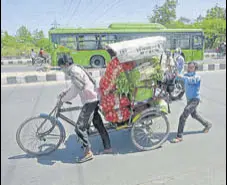  ?? SUSHIL KUMAR/HT PHOTO ?? People carry vegetables on a cycle rickshaw at Preet Vihar in New Delhi on Thursday.