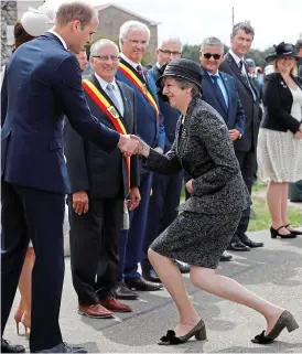  ??  ?? Duty: Prince William greets Theresa May at Tyne Cot yesterday