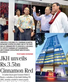  ??  ?? JOHN KEELLS HOLDINGS PLC CHAIRMAN SUSANTHA RATNAYAKE (CENTRE) DESCRIBES ONE OF THE PAINTINGS AT CINNAMON RED TO JOHN KEELLS HOLDINGS PLC DEPUTY CHAIRMAN AJIT GUNAWARDEN­E AND ECONOMIC DEVELOPMEN­T MINISTER BASIL RAJAPAKSA
PIX BY MANOJ RATNAYAKE