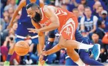  ?? JIM MONE/ASSOCIATED PRESS ?? James Harden, front, scored 22 of his 36 points in the Rockets’ 50-point third quarter to help Houston beat Minnesota Monday to take a 3-1 series lead.