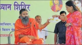  ?? HT PHOTO ?? Chief minister Vasundhara Raje and Baba Ramdev release a Swadeshi Samruddhi card at foundation stone laying ceremony of Patanjali Yogapeeth's branch at Karauli on Sunday.