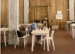  ?? MANU FERNANDEZ AP ?? A customer checks her laptop at a mostly empty restaurant in Madrid, Spain, Friday.