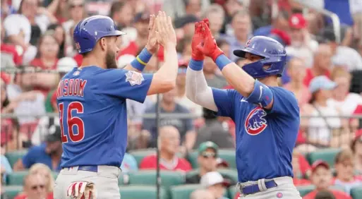  ?? AP ?? The Cubs’ Nico Hoerner is congratula­ted by teammate Patrick Wisdom after hitting a two-run home run in the second inning Friday against the Cardinals in St. Louis.