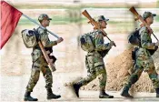  ?? —DC ?? A group of army jawans walk through the Parade Ground on Friday.