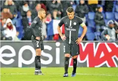  ??  ?? Kylian Mbappe (L) and Paris Saint-Germain captain Thiago Silva in disbelief after their side’s Champions League exit against Manchester United on Wednesday. - AFP photo