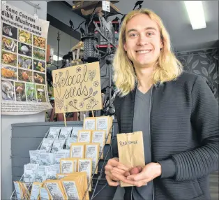  ?? MELISSA WONG/SPECIAL TO THE TELEGRAM ?? Jackson Mclean holds the red smile potatoes in E.W. Gaze Seeds Co. in downtown St. John’s.