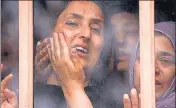  ?? REUTERS ?? Wife of Shujaat Bukhari mourns during his funeral at Kreeri near Srinagar on Friday.