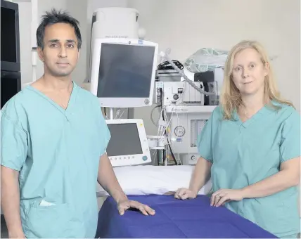  ??  ?? &gt; Eleri Davies, consultant breast surgeon, and consultant plastic surgeon Amar Ghattaura