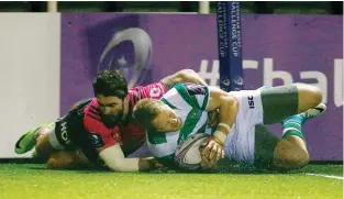  ??  ?? Flying high: Alex Tait scores Newcastle’s third try against Brive