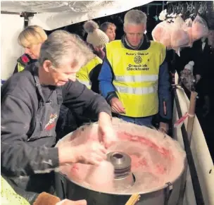  ??  ?? The Rotary Club of Ormskirk Clocktower candy floss team in action