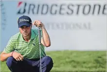  ?? ASSOCIATED PRESS FILE PHOTO ?? Justin Thomas reads the green on the 18th hole during the final round of the Bridgeston­e Invitation­al golf tournament Sunday in Akron, Ohio.