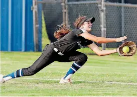  ?? [PHOTO BY NATE BILLINGS, THE OKLAHOMAN] ?? Deer Creek’s Macy Stockton makes a diving catch for an out during Monday’s softball game against Edmond North at Deer Creek High School.