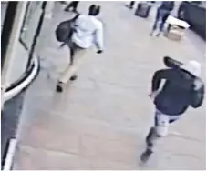  ??  ?? Caught on CCTV: A man runs away after the stabbing
