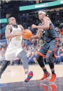  ?? JOHN BAZEMORE/ASSOCIATED PRESS ?? Toronto’s Pascal Siakam (43) defends Atlanta’s Taurean Prince during the Raptors win Thursday. Siakam scored 33 points.