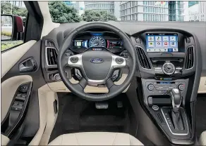  ?? — FORD CANADA ?? The 2016 Ford Focus EV features essentiall­y the same cockpit as the gas version, albeit with gauges for battery power.