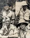  ??  ?? Vahry, front left, with fellow officers, and one of his photos depicting the conditions during the campaign to oust the Japanese from the Pacific.