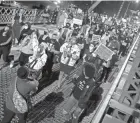  ?? DAVE KILLEN/THE OREGONIAN VIA AP ?? Protesters march Friday toward the Hawthorne Bridge in Portland, Ore., after a fatal shooting by police.