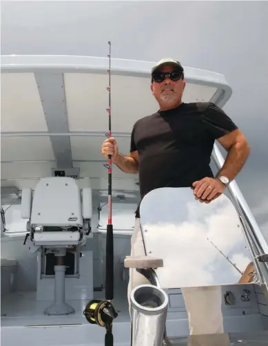  ??  ?? Joel aboard the Ellis 36 Argos in 2008. The boat had a streamline­d superstruc­ture reminiscen­t of sportfishi­ng vessels of an earlier era and a modern Downeast hull shape.