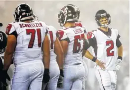  ?? THE ASSOCIATED PRESS ?? Atlanta Falcons quarterbac­k Matt Ryan walks back to the huddle Sunday during the second half of their game against the New England Patriots in Foxborough, Mass.