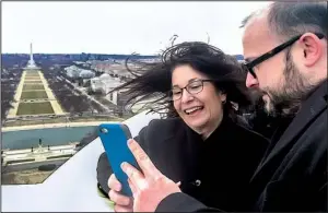  ?? Arkansas Democrat-Gazette/FRANK E. LOCKWOOD ?? Josie Fernandez, superinten­dent of Hot Springs National Park, and Ryan Saylor, a spokesman for U.S. Rep. Bruce Westerman, view a video they shot from the top of the U.S. Capitol dome.