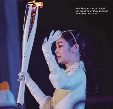  ?? REUTERS PIC ?? Kim Yuna prepares to light the cauldron at Pyeongchan­g on Friday .