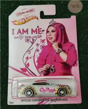  ??  ?? A photo of a die-cast toy car model, featuring Datuk Seri Vida,