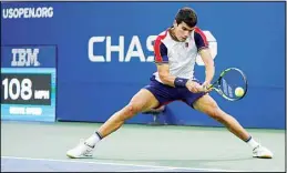  ??  ?? Carlos Alcaraz of Spain returns a serve against Peter Gojowczyk of Germany during the fourth round of the U.S. Open tennis championsh­ips, on Sept. 5, in New York. (AP)