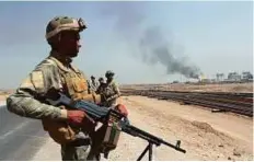  ?? Reuters ?? Iraqi troops during a patrol tour for the media at the oilfields in Basra, southeast of Baghdad on July 25.