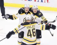  ?? FRED CHARTRAND/THE CANADIAN PRESS VIA ASSOICATED PRESS ?? Boston Bruins defenseman Torey Krug (47) celebrates his winning goal with teammates Brad Marchand (63) and David Krejci (46) at the end of overtime.