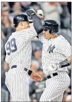  ?? N.Y. Post: Charles Wenzelberg ?? BASH BROTHERS: Gary Sanchez (right) celebrates the first of his two homers Thursday with Aaron Judge.