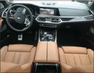  ?? MARC GRASSO — BOSTON HERALD ?? The 5,950-pound BMW X7M50i has a 4.4L V8, all-wheel drive and an ultra-smooth ride. The seats are exceedingl­y comfortabl­e and the features inside include a leather dash.