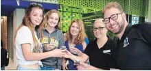  ?? KRIS DUBE ?? Students Rebecca Ferrera, left, Brittany Klassen and Susan Clifford, with food and beverage staff Linda Marasco and student administra­tive council president Ryan Huckla.