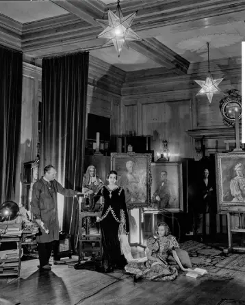  ??  ?? ARISTO ART: Oswald Birley and his wife Rhoda with daughter Maxine (Maxime de la Falaise) sitting on the floor. Photo: Cecil Beaton/Getty. Above right, Rhoda painted by her husband