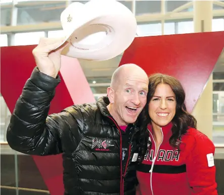 ?? JIM WELLS ?? Michael “Eddie the Eagle” Edwards poses with Paralympia­n Michelle Salt after arriving at Calgary Internatio­nal Airport from the United Kingdom on Sunday. Edwards is in Calgary to support the city’s possible bid to host the 2026 Olympic and Paralympic Winter Games.