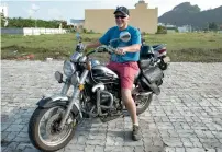  ?? AFP ?? Mark O’Connor parks his motorbike nearby the Hyatt Resort in the central Vietnamese city of Danang on Friday. —