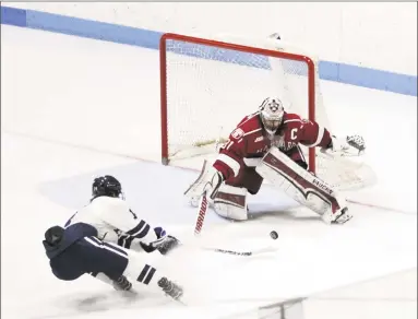  ?? Steven Musco / Yale Athletics ?? Second-period action from Saturday's men's hockey game between Yale and Harvard at Ingalls Rink.