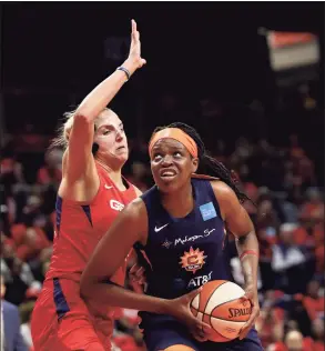  ?? Rob Carr / Getty Images ?? The Sun’s Jonquel Jones, right, drives to the basket against the Mystics’ Elena Delle Donne during Game 5 of the 2019 WNBA Finals in Washington.