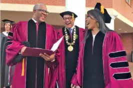  ?? BO EMERSON/ATLANTA JOURNAL-CONSTITUTI­ON VIA AP ?? Robert F. Smith, left, laughs with David Thomas, center, and actress Angela Bassett at Morehouse College on Sunday in Atlanta.