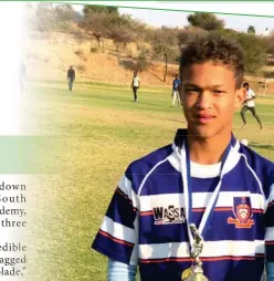  ?? ?? Footballer Godwin Beukes holding a trophy his team Kaizen Football Academy won in the Valentine’s Cup at Jan Mohr Secondary School in 2023.