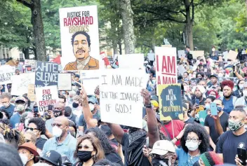  ?? AP ?? A crowd of demonstrat­ors march to the Capitol in Atlanta, Georgia, on Monday.