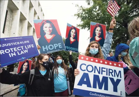  ?? Jose Luis Magana / Associated Press ?? Supporters of President Donald Trump’s Supreme Court nominee, Amy Coney Barrett, rally at Capitol Hill in Washington on Monday.