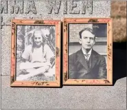  ?? ?? Photos of Marie LaPish, 8, and Robert LaPish, 18, were displayed on the Memorial of the Unidentifi­ed during a memorial service at Fairview Cemetery in Boyertown on Jan. 15. The Boyertown siblings perished in the 1908 Rhoads Opera House fire.