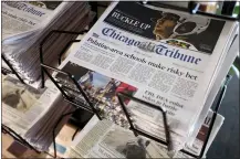  ?? THE ASSOCIATED PRESS ?? Chicago Tribune and other newspapers are displayed at Chicago’s O’Hare Internatio­nal Airport. Hedge fund Alden, Tribune’s largest shareholde­r, has offered to buy the rest of the newspaper publisher.