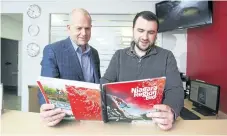  ?? JULIE JOCSAK/POSTMEDIA NETWORK ?? Doug Hamilton, chairman of Niagara's bid committee, left, and Matt Hill, director of sport and venues for the bid committee, are shown with a copy of the Niagara bid package for the Canada Summer Games.