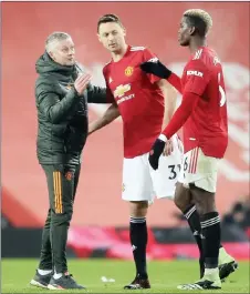  ?? — AFP file photo ?? Solskjaer (left) speaks with Manchester United’s Nemanja Matic (centre) and Paul Pogba during an English Premier League match.